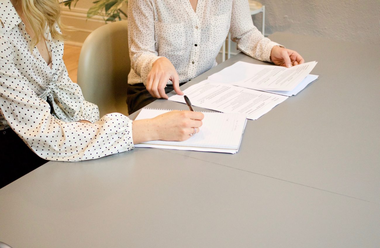 Woman signing approval of a document